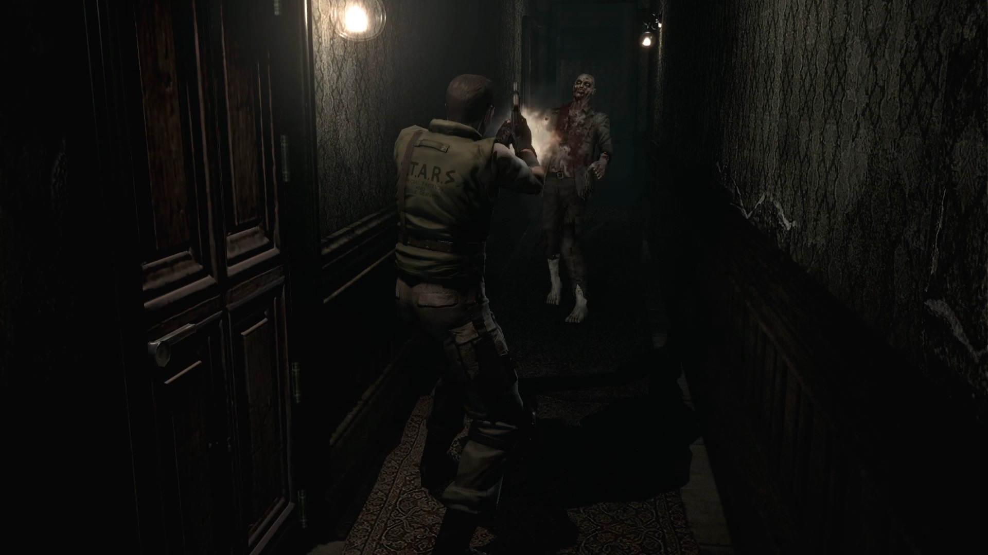 ゾンビの頭部にナイフを突き刺すクリスの画像